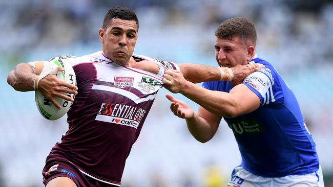 Jamal Fogarty of the Bears is tackled by Billy Magoulias of the Jets during the 2019 National State Championship Grand Final between the Newtown Jets and the Burleigh Bears at ANZ Stadium in Sydney, Sunday, October 6, 2019