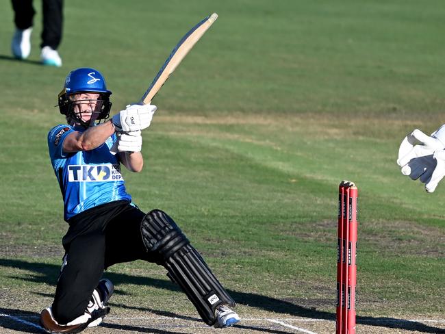 BRISBANE, AUSTRALIA - OCTOBER 28: Katie Mack of the Strikers hits the ball to the boundary for a four during the Women's Big Bash League match between the Adelaide Strikers and the Perth Scorchers at Allan Border Field, on October 28, 2022, in Brisbane, Australia. (Photo by Bradley Kanaris/Getty Images)