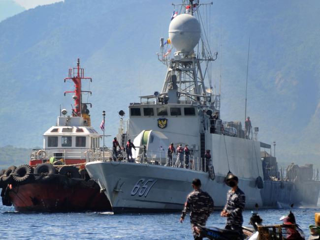 The Indonesian navy patrol boat KRI Singa load provisions at the naval base in Banyuwangi, East Java province, on April 24, during search operations off Bali. Picture; AFP