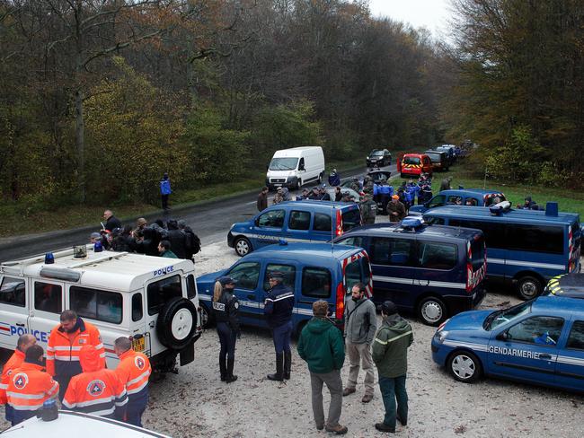 Animal hunt ... Police gather in Villeneuve Saint-Denis to search for the cat. Picture: Thibault Camus/AP