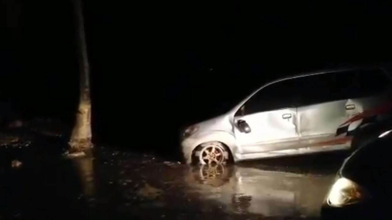 Social media vision shows cars strewn after the tsunami.