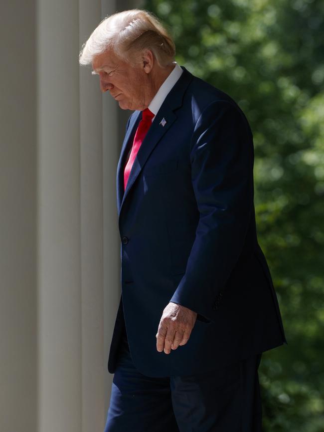 President Donald Trump arrives for a National Day of Prayer event in the Rose Garden of the White House on Thursday. Pic: AP Photo/Evan Vucci.