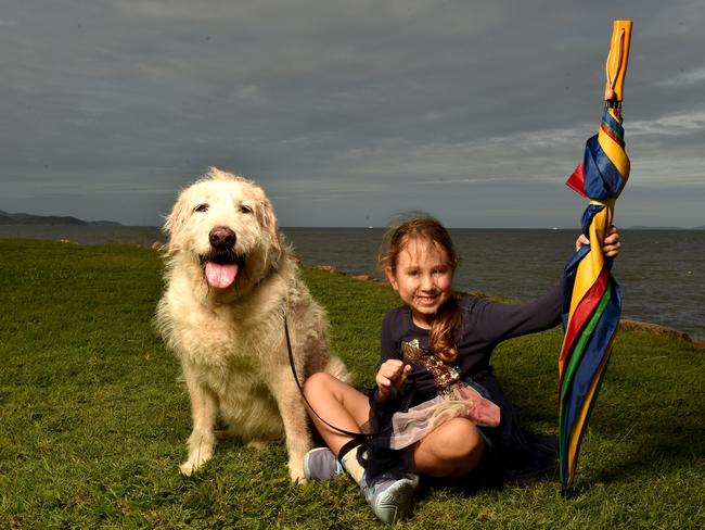 Remy Moore, 5, with Cooper is ready for rain on the strand. Picture: Evan Morgan