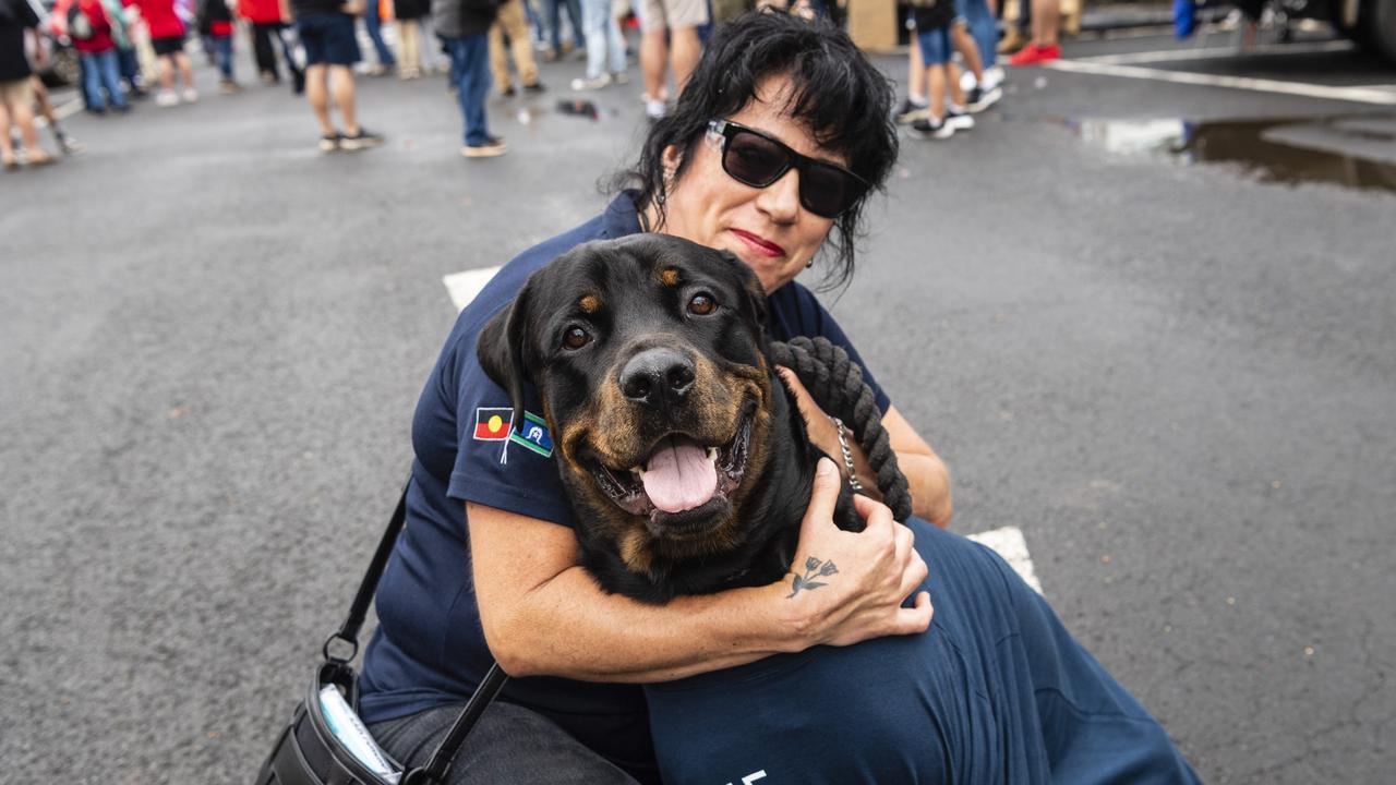 Claudia Reyes and her rottweiler Logan show support for The Services Union at the Labour Day 2022 Toowoomba march, Saturday, April 30, 2022. Picture: Kevin Farmer