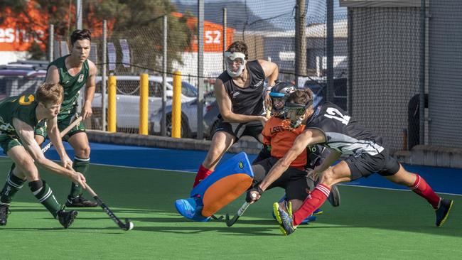 Trent Goldenstein, Ipswich takes on Jonathan Allcock, Logan Templeton and Joshua Baxter from Mackay. Ipswich vs Mackay. Hockey Queensland Championship. Saturday, May 1, 2021. Picture: Nev Madsen.