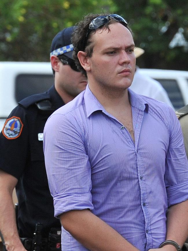 Zak <s1>Grieve is flanked by NT Police during a visit to the scene where Ray Niceforo was murdered</s1>. Picture: Katrina Bridgeford