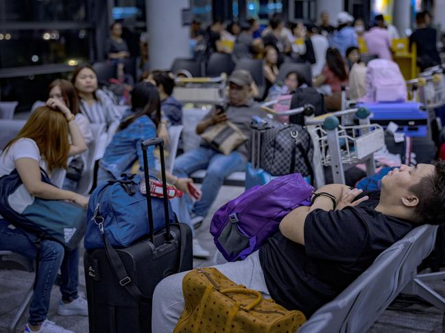 Passengers wait for check-in counters to open at Manila’s airport. Picture: Ezra Acayan/Getty Images