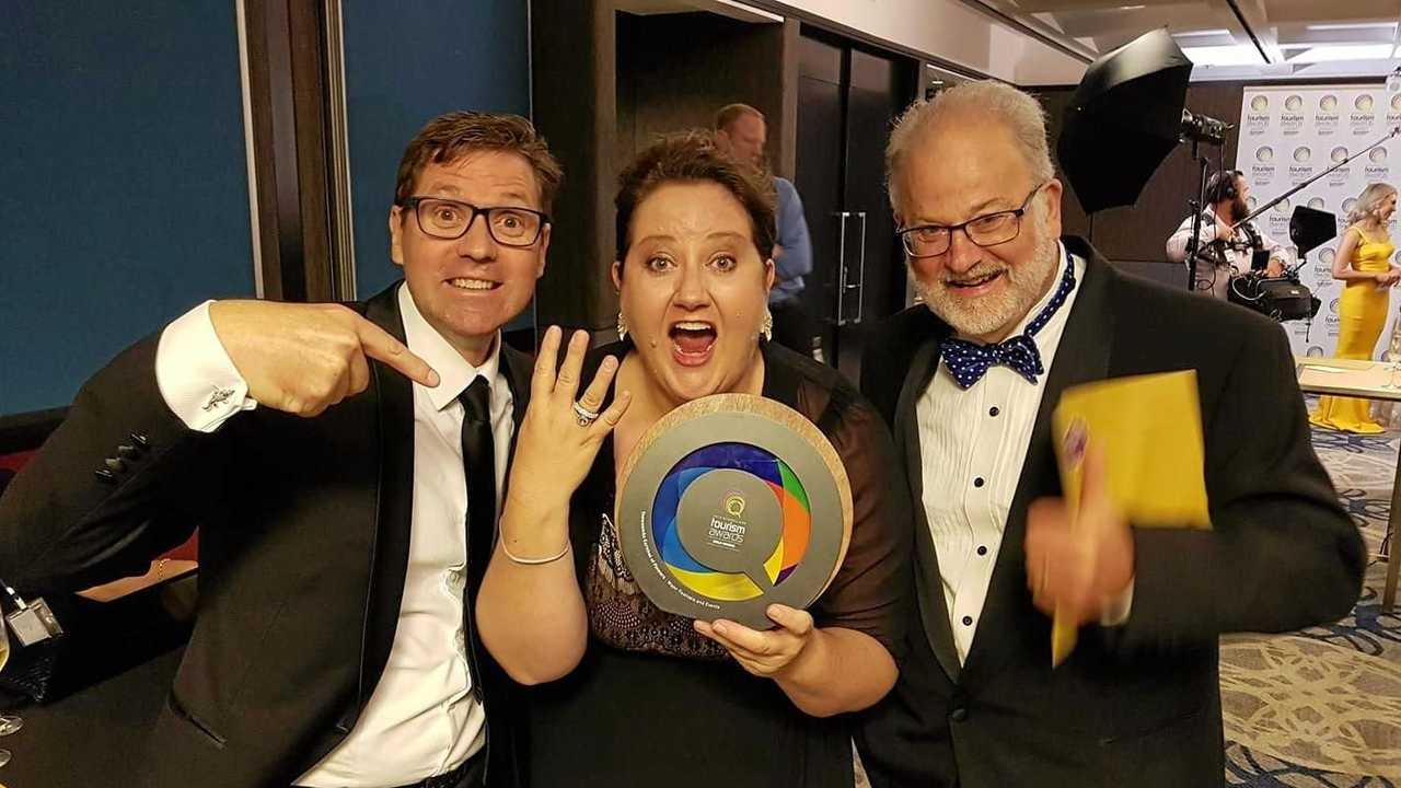 Cr Geoff McDonald, Kate Scott and Ross Begent celebrating the Carnival of Flowers' fourth win at the Queensland Tourism Awards last night. Picture: Contributed