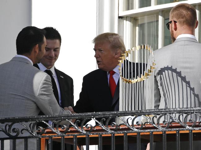 President Donald Trump speaks with Washington Nationals starting pitchers Anibal Sanchez, from left, Patrick Corbin and Stephen Strasburg after an event to honor the 2019 World Series champion Nationals baseball team at the White House, Monday, Nov. 4, 2019, in Washington. (AP Photo/Patrick Semansky)