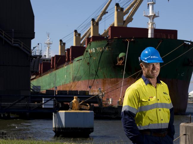 Grant Innes, Port Officer at The Port of Newcastle with a Coal ladden vessel in the background. Picture Peter Stoop.