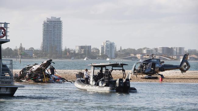 The devastating scene of a Helicopter crash between two Sea World Helicopters just outside the tourist park on a sandbank in the Southport Broadwater. Picture: Glenn Hampson.