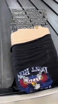 Woman uses boyfriend's T-shirt to cover suitcase