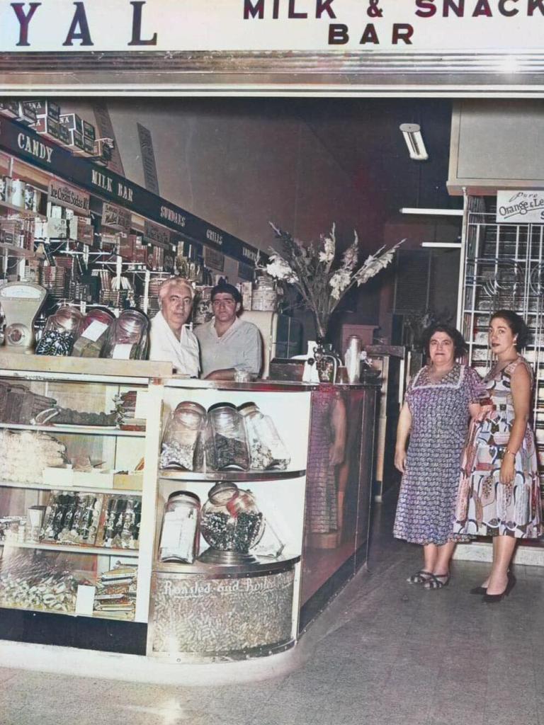 The Cafe Royal was the place to be seen back in the day. Pictured at the counter are Mark, Ben, Maritisa and Chrissa Lathouras. Photo: State Library of Queensland.