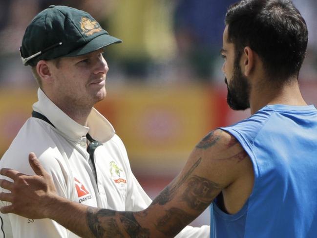 Australia's captain Steven Smith, left, and India's captain Virat Kohli shake hands after India won their fourth test cricket match against Australia in Dharmsala, India, Tuesday, March 28, 2017. India won the Border-Gavaskar trophy and the series. (AP Photo/Tsering Topgyal)