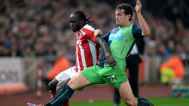 Stoke City's Victor Moses, left, battles for the ball with Newcastle United's Daryl Janmaat.