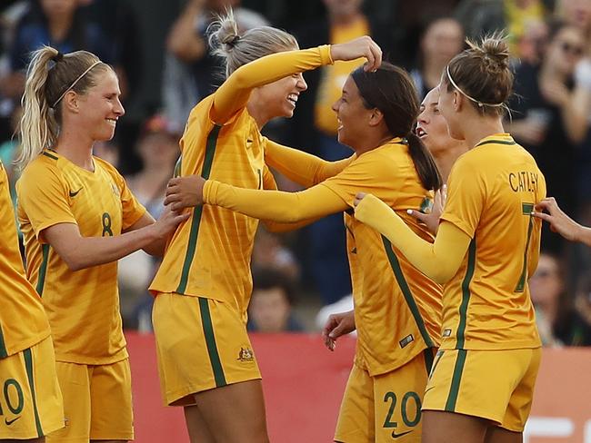 The Matildas celebrate their win over Brazil.