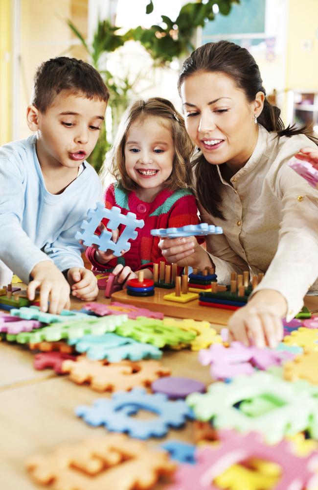 Generic photo of a childcare worker and children in a daycare centre