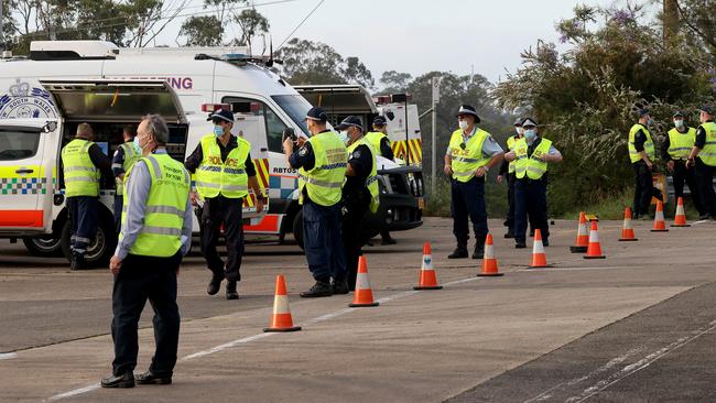 NSW Police and Transport NSW officers at the truck depot this morning. Picture: Toby Zerna