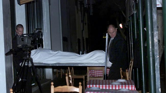 Andrew Veniamin’s body is removed from La Porcella restaurant in Rathdowne Street. Picture: Fiona Hamilton