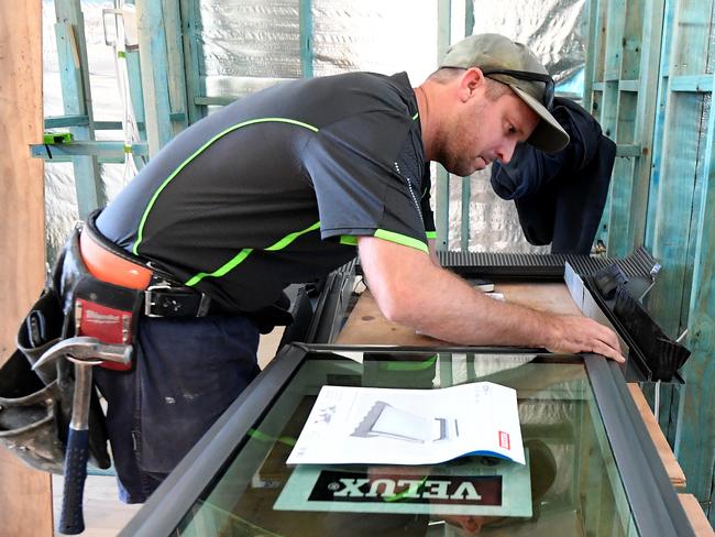 Foreman Nick Mus, of Morbuild Builders, is seen working on a house renovation in Brisbane, Thursday, June 4, 2020. The Federal Government will give eligible Australians $25,000 to build or substantially renovate their homes, in an effort to boost demand in the construction sector and keep builders employed. (AAP Image/Dan Peled) NO ARCHIVING