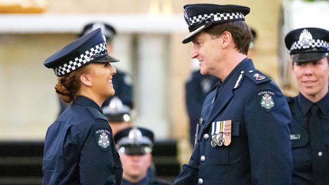 Graduate Jessica Carr is congratulated by Victoria Police Deputy Commissioner Shane Patton. Picture: Mark Stewart