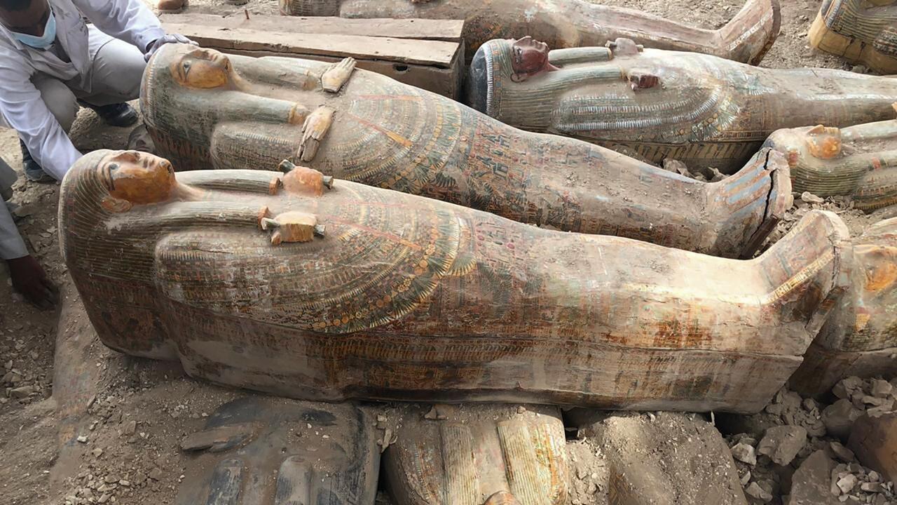 Some of the discovered coffins stacked on top of one another.