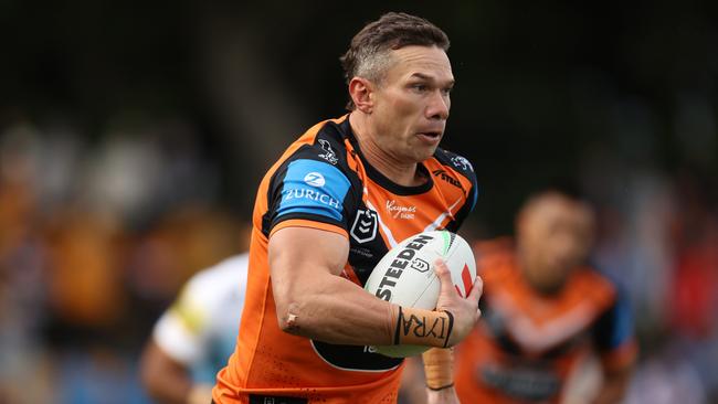 SYDNEY, AUSTRALIA - JUNE 15: Brent Naden of the Wests Tigers runs the ball during the round 15 NRL match between Wests Tigers and Gold Coast Titans at Leichhardt Oval on June 15, 2024 in Sydney, Australia. (Photo by Jason McCawley/Getty Images)