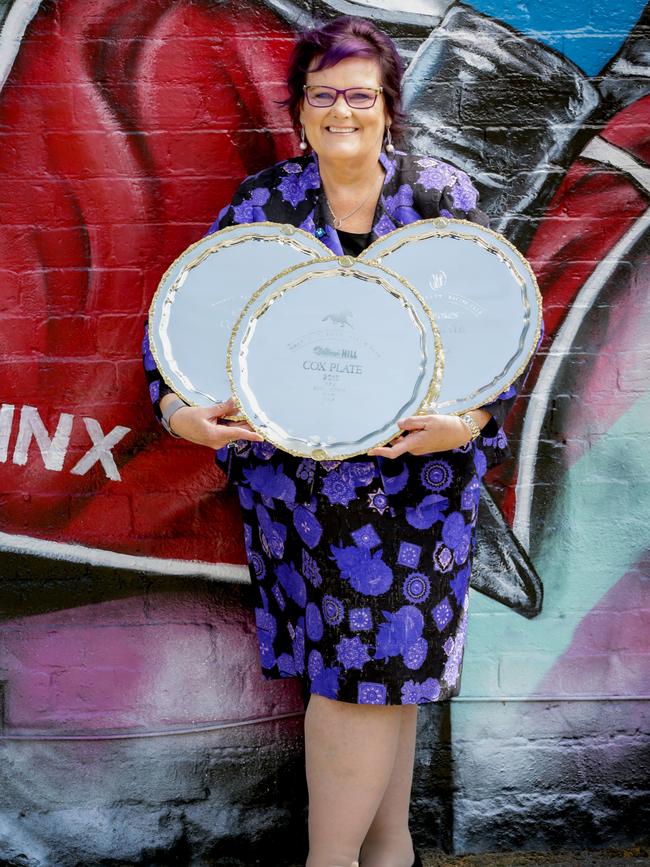 Winx co-owner Debbie Kepitis at the mural of Winx in Ascot Vale with the three Cox Plates.