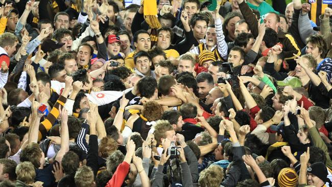 Fans mob Lance Franklin after he kicked his 100th goal in 2008.