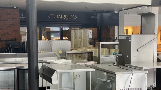 Staff at Charlie’s Restaurant Cafe and Bar in Surfers Paradise moving furniture in the business on Thursday afternoon.