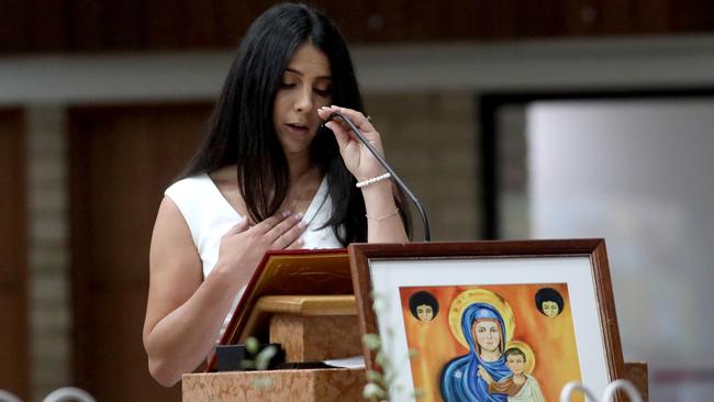 Leila Abdallah honours her children during the mass. Picture: Damian Shaw