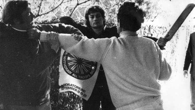 Tom Hughes grabs anti-Vietnam protester outside his Sydney home in 1970.