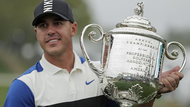 Brooks Koepka holds up the Wanamaker Trophy after winning the PGA Championship. Picture: AP