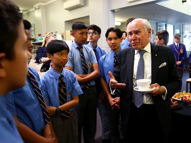 Former Prime Minister John Howard visits his old high school, Canterbury Boys High where the NSW state government will build an assembly hall which will be named after their most famous graduate. Mr Howard meets students during a morning tea. Picture: Toby Zerna