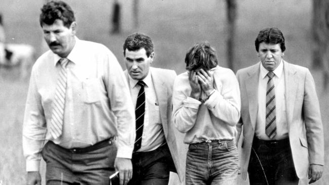 One of Ms Cobby’s killers (3rd from left) during a renactment with detectives at the paddock in Prospect. Picture: Supplied 