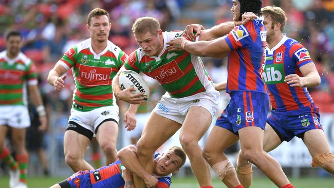 George Burgess of the Rabbitohs is tackled.