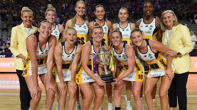 Sunshine Coast Lightning pose with the Queensland Cup trophy after their victory over the Queensland Firebirds. (Photo by Albert Perez/Getty Images)