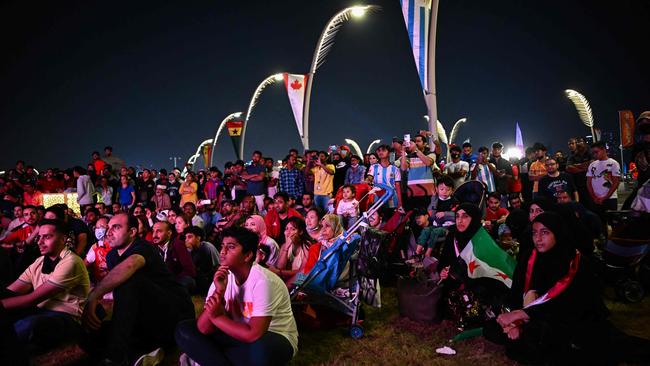 Fans gather to watch a live broadcast of the opening ceremony of the Qatar 2022 World Cup at the Corniche of Doha. Picture: AFP