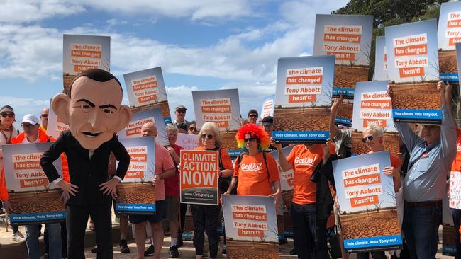 GetUp! volunteers in the federal electorate of Warringah, along with a Tony Abbott figure, launched a national campaign to unseat conservative MPs. Picture: Jim O'Rourke 