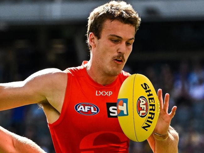 PERTH, AUSTRALIA - MARCH 16: Charlie Ballard of the Suns chases the loose ball in front of Oscar Allen of the Eagles during the 2025 AFL Round 01 match between the West Coast Eagles and the Gold Coast Suns at Optus Stadium on March 16, 2025 in Perth, Australia. (Photo by Daniel Carson/AFL Photos via Getty Images)