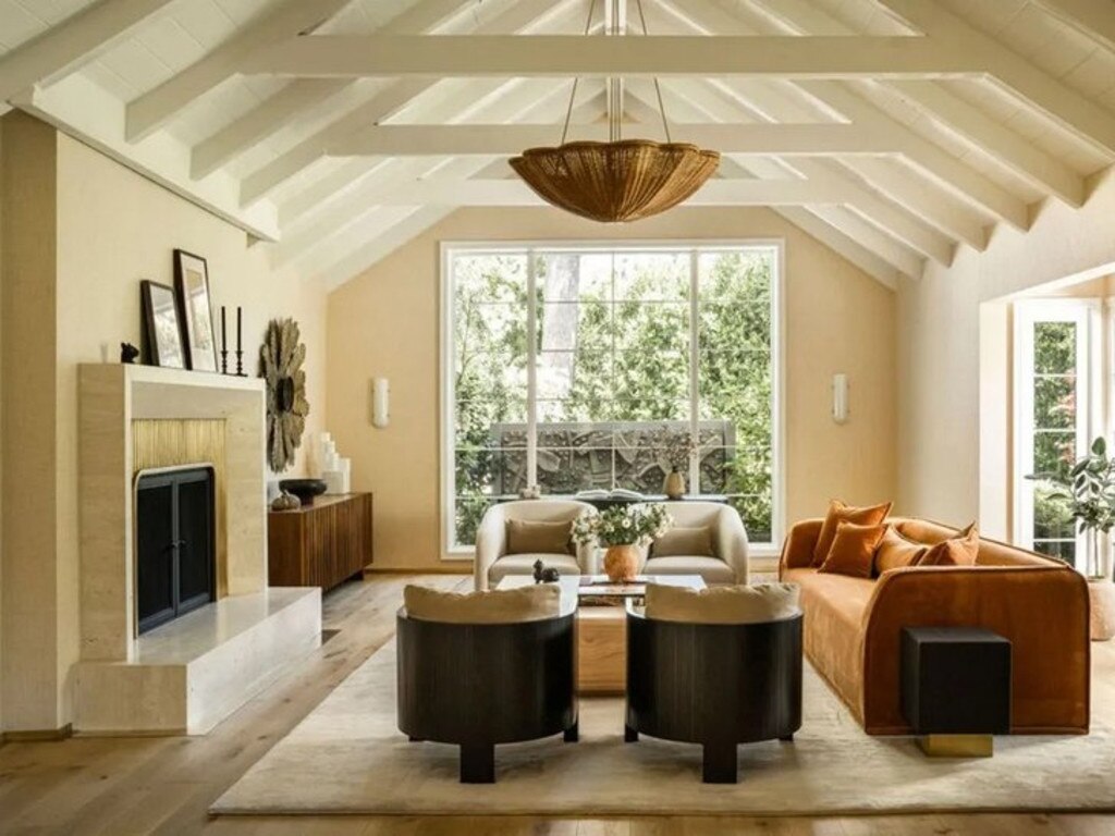 The formal living room with coffered ceiling and fireplace. Picture: Realtor.com