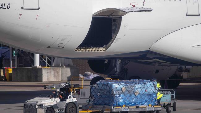 Luggage from the SriLankan Airlines Airbus is removed from the plane. Picture: Ian Currie