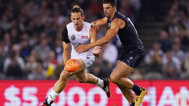 Nat Fyfe (left) and Scott Pendlebury are two of the AFL’s most dedicated players. Picture: AAP Image