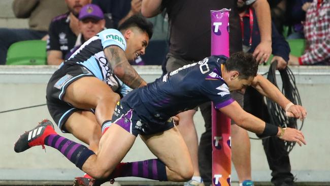 Billy Slater is in trouble for this shoulder charge on Sosaia Feki. Picture: Getty Images