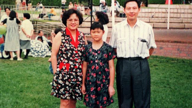 Quanne Diec with her parents Ann and Sam aged 11 at Darling Harbour.