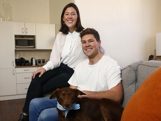 Libby Littleyuile and Dave Franks with their dog "Miso" in their Bondi home talking about the rising cost of living. Picture: John Appleyard