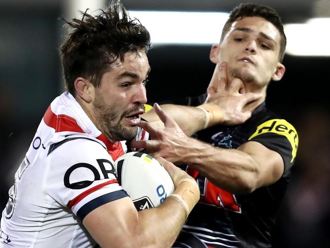 Roosters Aidan Guerra fends off the Panther's Nathan Cleary during the Round 22 NRL game between the Penrith Panthers and the Sydney Roosters at Pepper Stadium , Penrith . Picture : Gregg Porteous