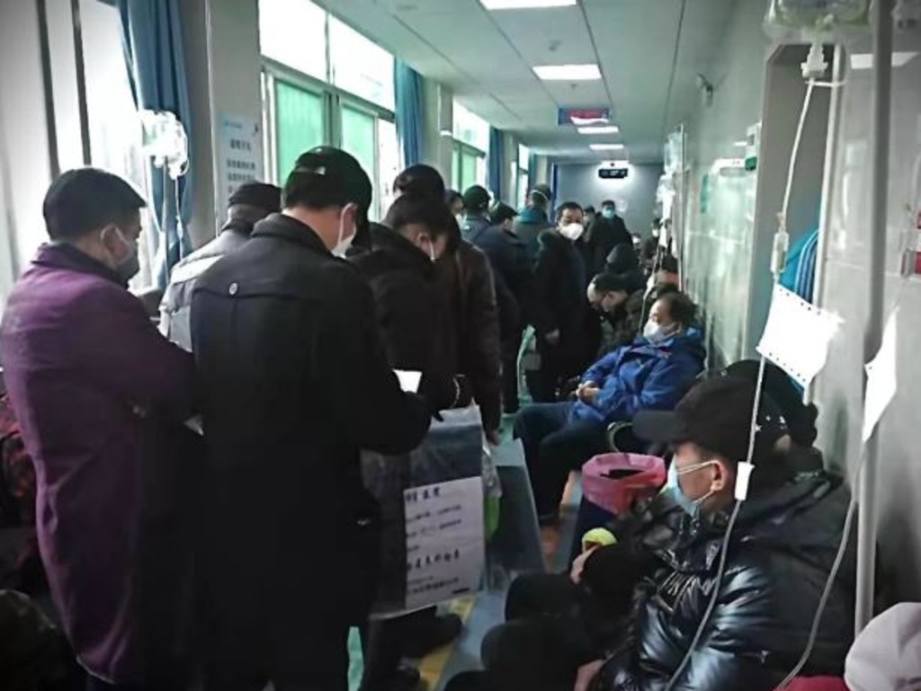 People wait to see doctors at Wuhan Fifth Hospital. Picture: Caijing.com.cn: