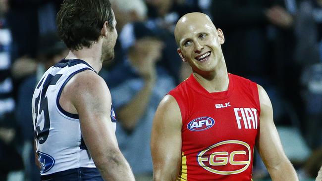 Gold Coast captain Gary Ablett shares a laugh with Geelong star Patrick Dangerfield. Picture: Colleen Petch