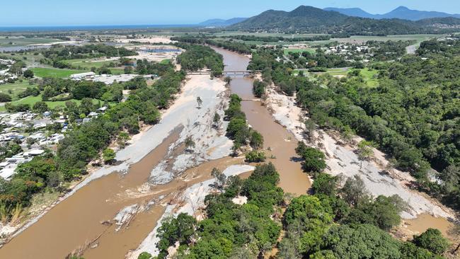 Barron River water level peaked at a record height following Cyclone Jasper, resulting in tonnes of rock and trees being swept downstream with millions of litres of muddy water. Picture: Brendan Radke